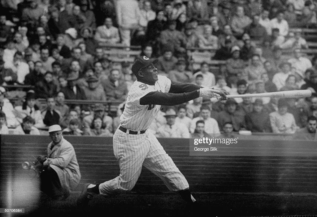 Chicago White Sox outfielder Orestes Minnie Minoso smiles as he poses in  Tampa, Fla., on March 9, 1957. Minoso, whose hometown is Marianao, Cuba,  became the first black player with the White