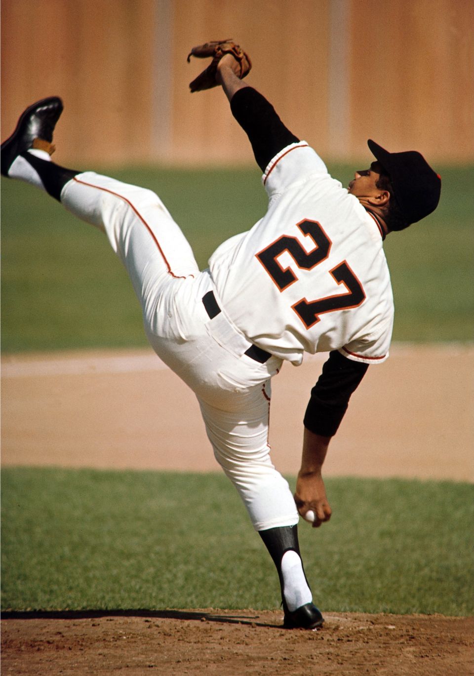 San Francisco Giants pitcher Juan Marichal hitting Dodger catcher