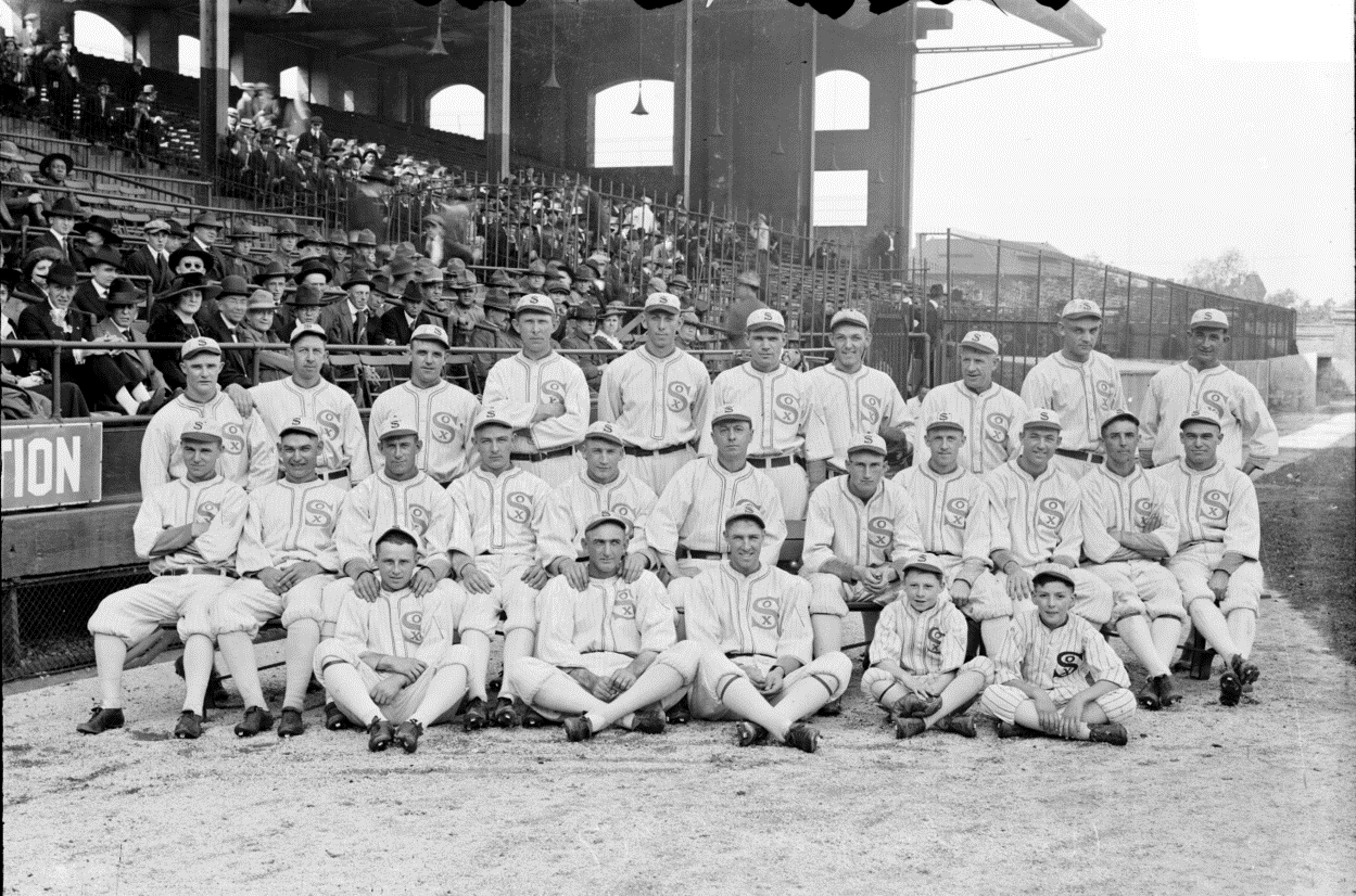 In 1913, the Reds lost a game to the Cubs, while wearing White Sox Uniforms.  The Reds' uniforms didn't make the trip, and the White Sox owner Comiskey  loaned the Reds his