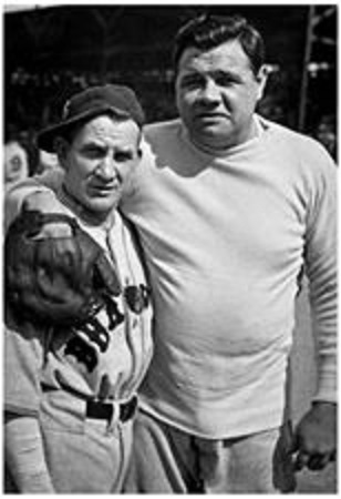 Babe Ruth as a Boston Brave poses with Red Sox players