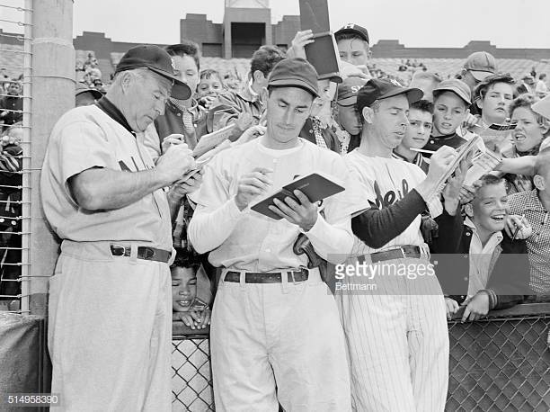 Joe Dimaggio And Mickey Mantle Holding by Bettmann