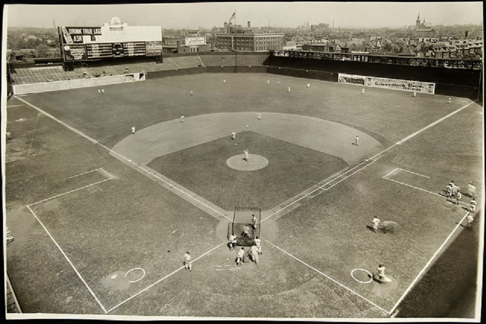 Members of the St. Louis Cardinals stand for a moment of silence for the  late New York Yankee Yogi Berra before a game against the Cincinnati Reds  at Busch Stadium in St.