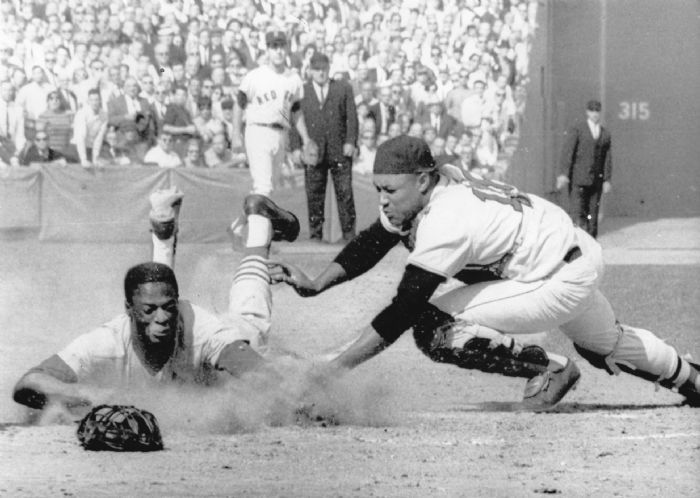 April 14, 1959 at Memorial Stadium in Baltimore: Yankee catcher, Elston  Howard tries to slide …