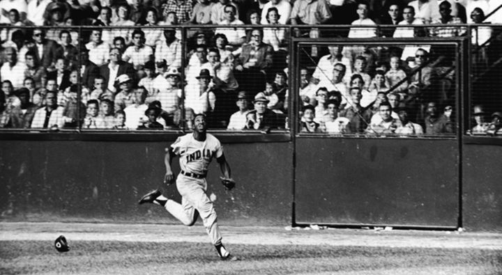 Chicago White Sox outfielder Orestes Minnie Minoso smiles as he poses in  Tampa, Fla., on March 9, 1957. Minoso, whose hometown is Marianao, Cuba,  became the first black player with the White