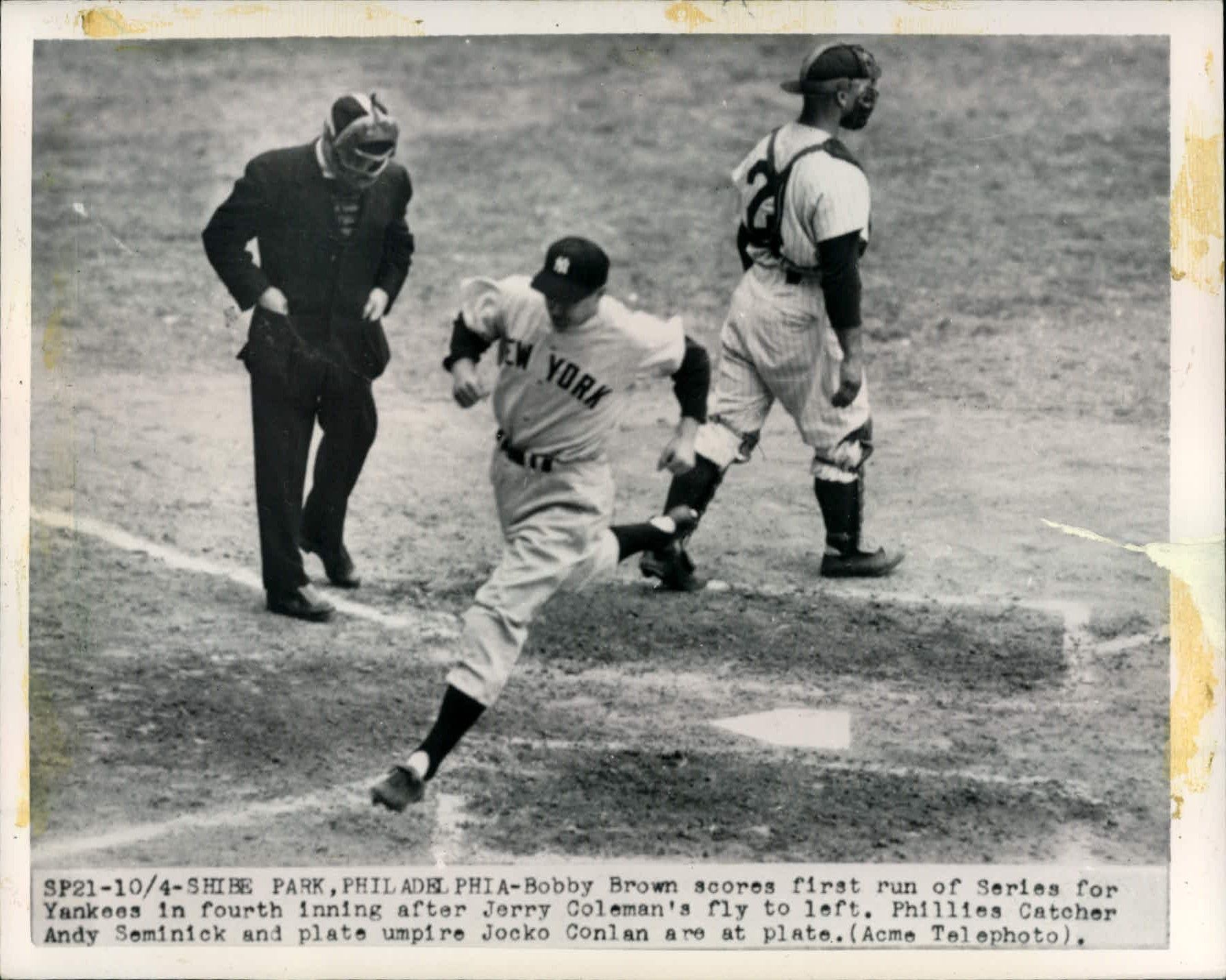 Catcher Jimmy Foxx of the Red Sox points to the outfield as DiMaggio of the  Yankees and the umpire looks on - Digital Commonwealth