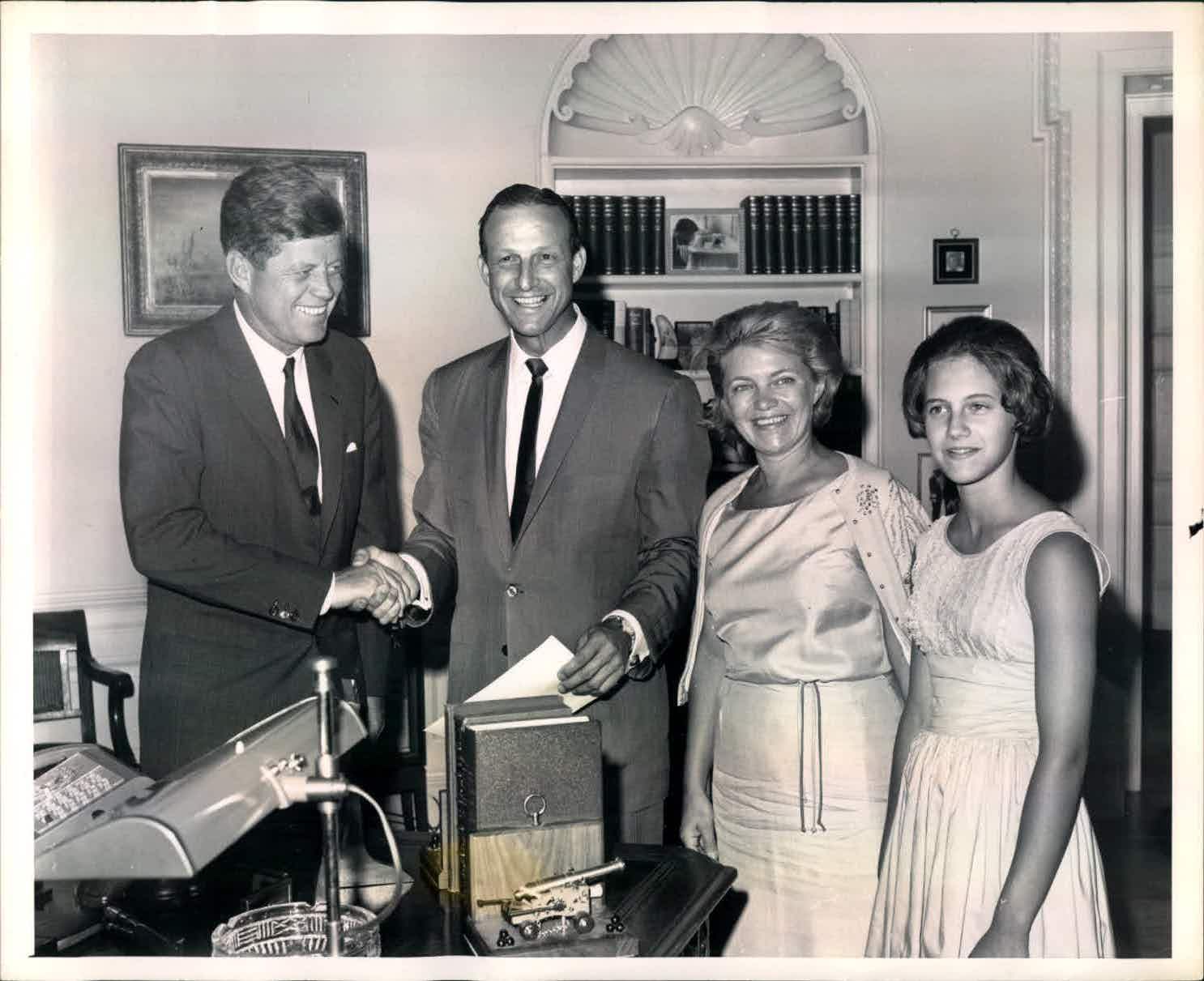 1963 Mrs. Stan Musial sits in front of a Musial family photo. - Historic  Images