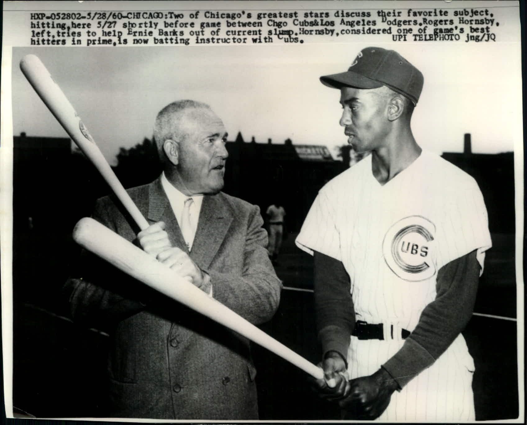 Chicago Cubs shortstop Ernie Banks swings his bat in batting