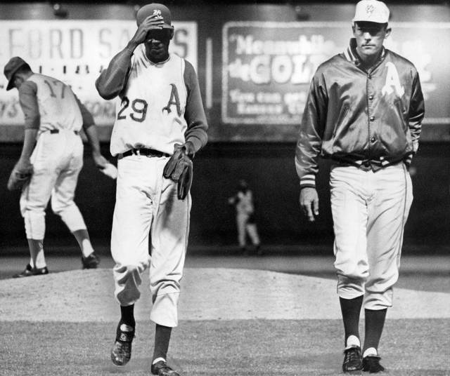 Joe Louis and Satchel Paige meet at Comiskey Park on August 13, 1948