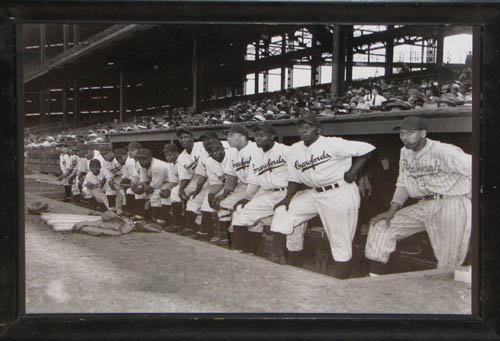 The 1932 Pittsburgh Crawfords, featuring 3 of the greatest players ever: Satchel  Paige is standing third from the left, Josh Gibson is standing next to Paige  and wearing a jacket, and Oscar