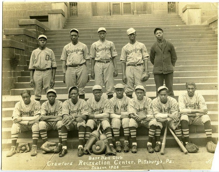 The 1932 Pittsburgh Crawfords, featuring 3 of the greatest players ever: Satchel  Paige is standing third from the left, Josh Gibson is standing next to Paige  and wearing a jacket, and Oscar