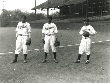 The 1932 Pittsburgh Crawfords, featuring 3 of the greatest players ever: Satchel  Paige is standing third from the left, Josh Gibson is standing next to Paige  and wearing a jacket, and Oscar