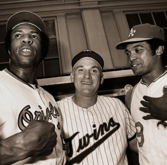 Jackie Robinson gives advice to Cincinnati Reds rookie Frank Robinson, 1956