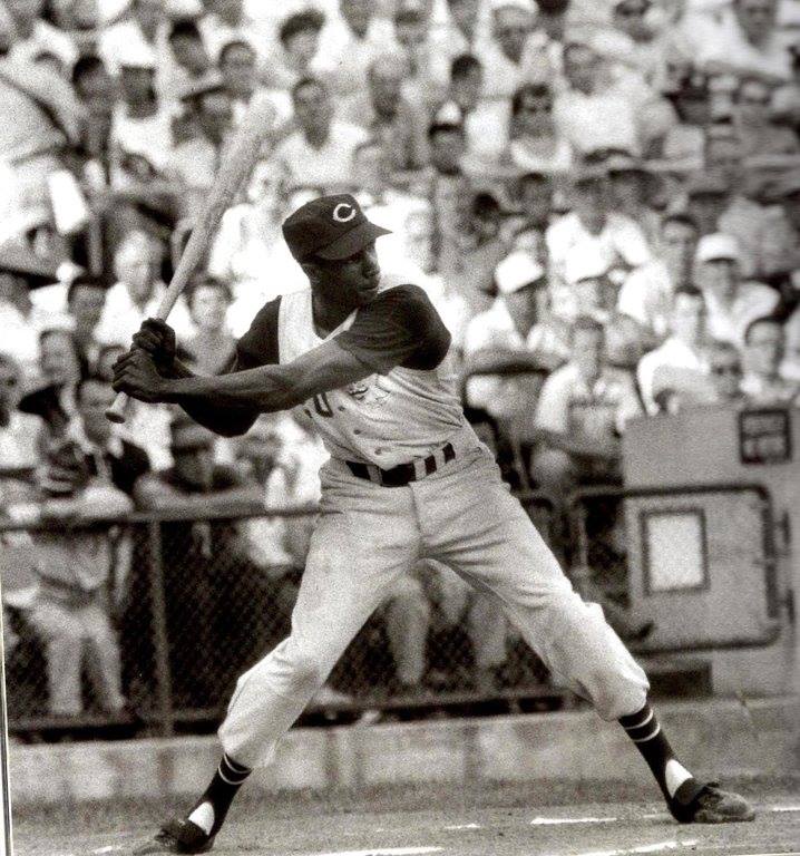 Frank Robinson (who passed away today) of the then-Cincinnati Redlegs poses  during batting practice before an MLB game against the Milwaukee Braves  circa August, 1956 at Milwaukee County Stadium. Mr. Robinson was