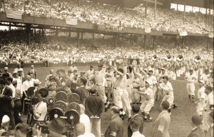 The balllaaerws scramble to catch the first pitch thrown out my President Roosevelt.