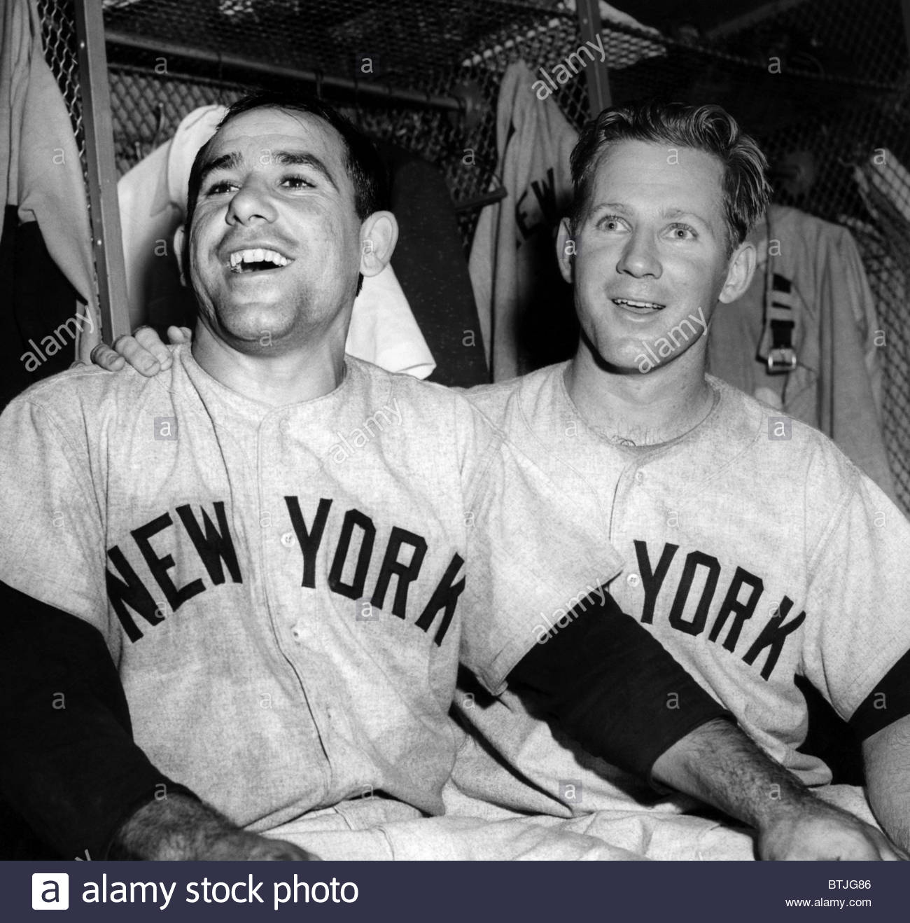 Babe Ruth in baseball uniform standing in dugout Stock Photo - Alamy